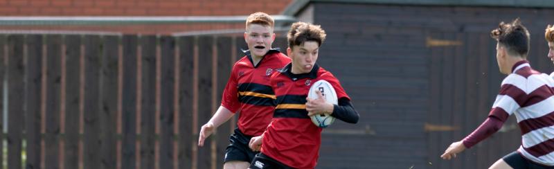 Boys playing rugby